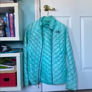 Women’s light blue North Face fall/running jacket